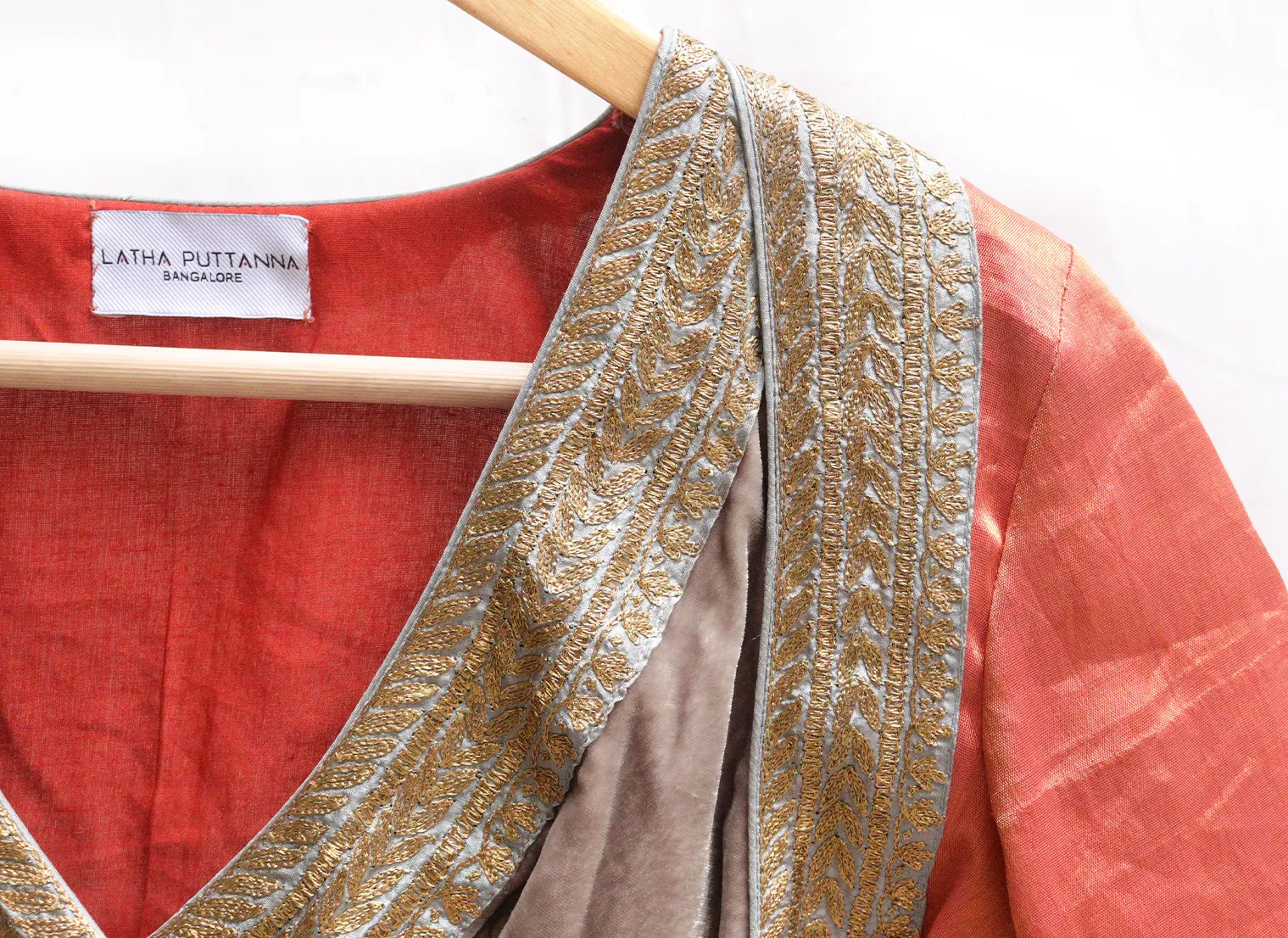 Light grey velvet potli with gold jari embroidery.